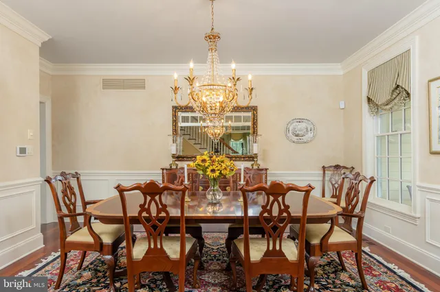 a kitchen with stainless steel appliances granite countertop a sink a stove and refrigerator