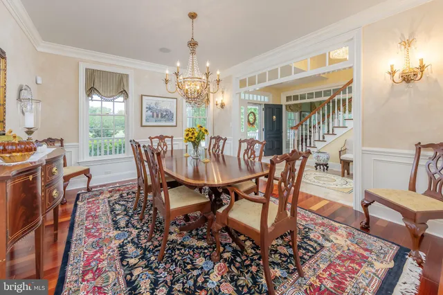 a kitchen with granite countertop white cabinets and stainless steel appliances
