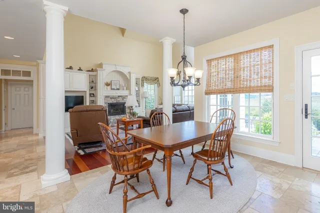 a spacious bedroom with a bed a couch and a window