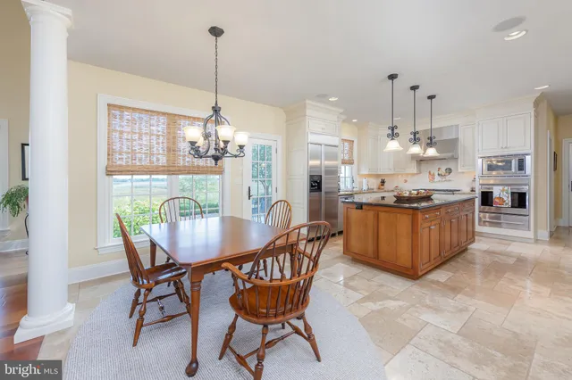 a view of a workspace with a bookshelf