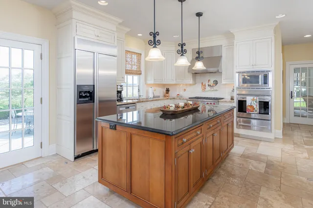 a spacious bathroom with a shower a sink and a mirror