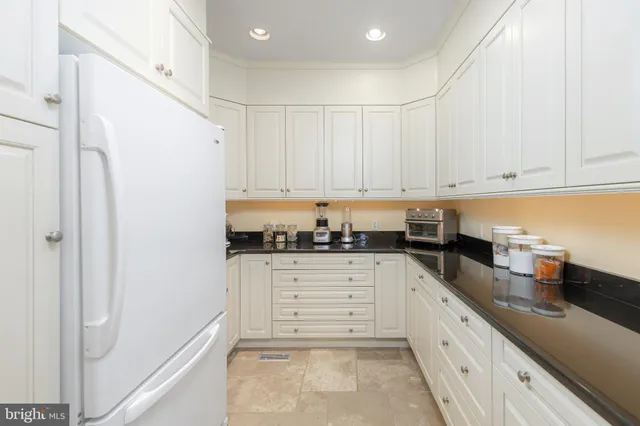 a view of a garage with wooden table and chairs