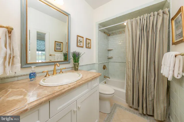 a view of a patio with a table and chairs and potted plants