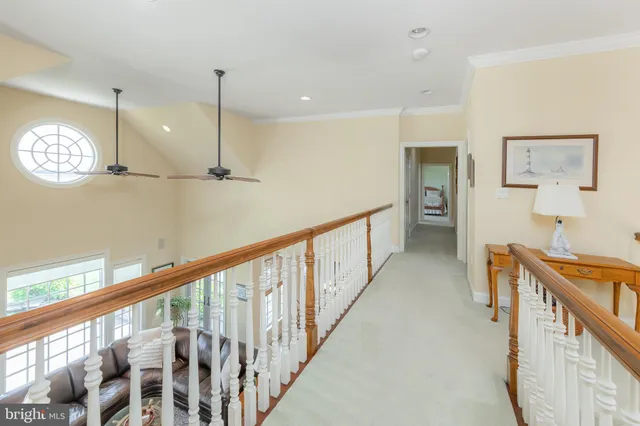 a view of a swimming pool with an outdoor seating and yard in the back