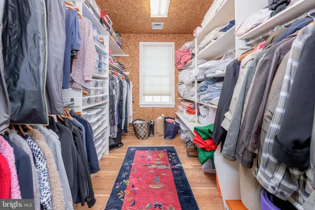 a front view of a house with a garden and yard