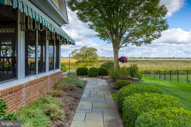 an aerial view of a residential houses with outdoor space