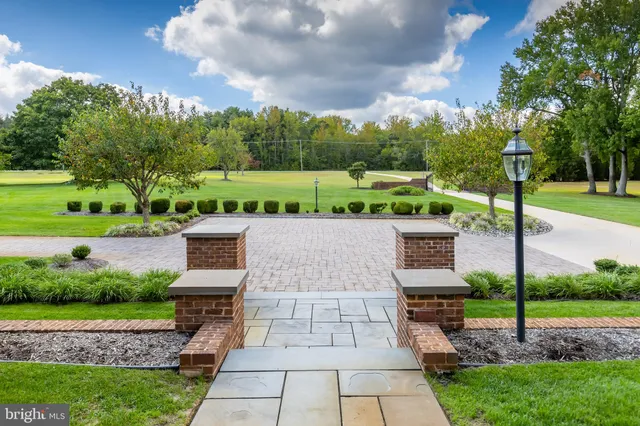 a living room with furniture a rug and a flat screen tv
