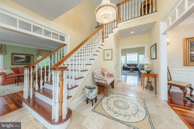 a living room with furniture a fireplace and a table