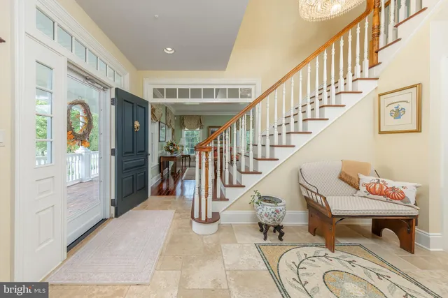 a view of a dining room with furniture and a fireplace