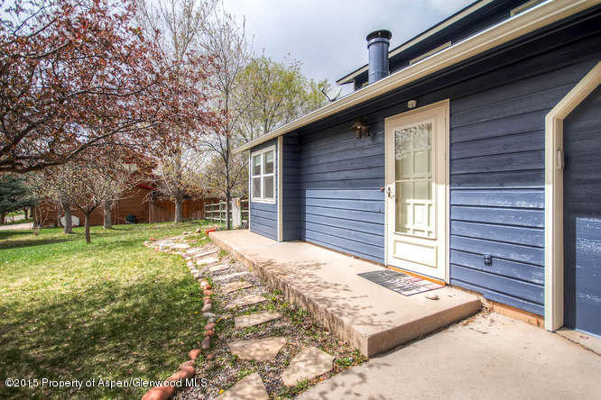 40 Riversedge Court, Unit A Basalt, CO 81621 - Photo 10 of 12 a view of a backyard with a large tree