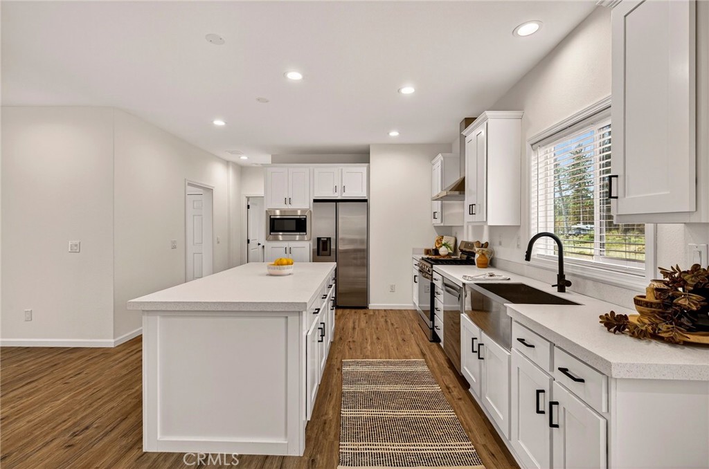 6160 Beacon Court Paradise, CA 95969 - Photo 12 of 34 a kitchen with stainless steel appliances a sink stove and refrigerator