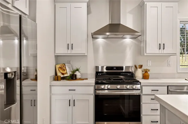 a kitchen with cabinets and appliances
