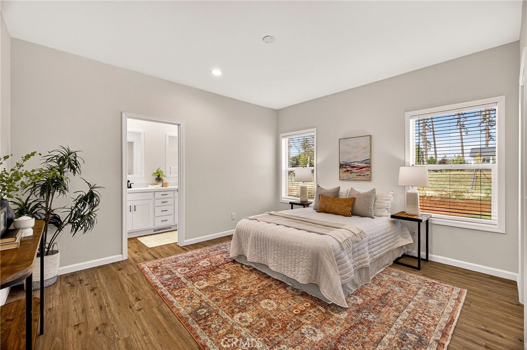 6160 Beacon Court Paradise, CA 95969 - Photo 16 of 34 a bedroom with a bed and a potted plant