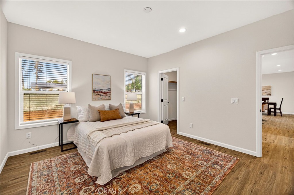 6160 Beacon Court Paradise, CA 95969 - Photo 18 of 34 a bedroom with a bed and wooden floor