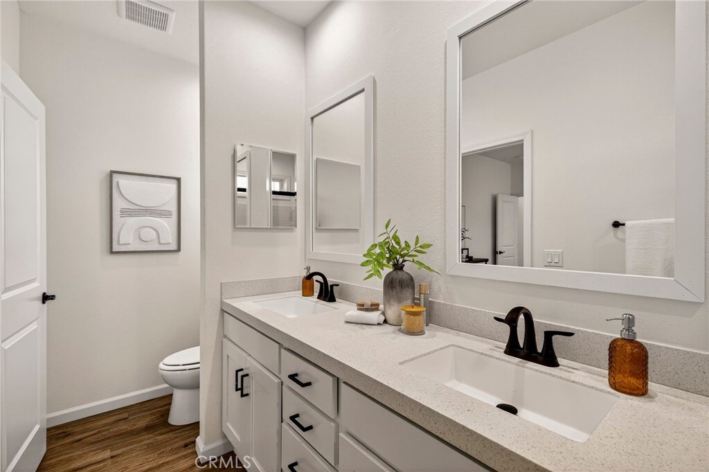 6160 Beacon Court Paradise, CA 95969 - Photo 21 of 34 a bathroom with a sink a toilet and a mirror