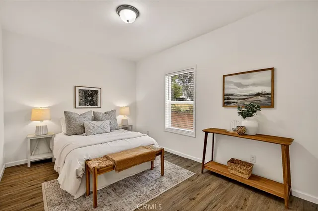 a bedroom with a bed and window