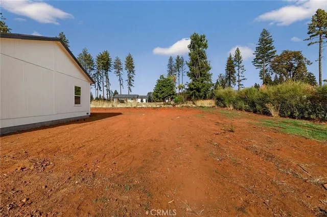 an aerial view of residential house with outdoor space and parking