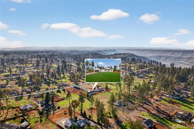 an aerial view of a house with a ocean view