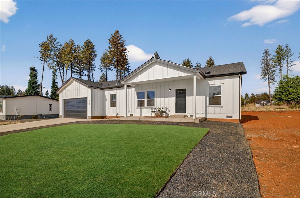 6160 Beacon Court Paradise, CA 95969 - Photo 4 of 34 a front view of a house with a garden and yard