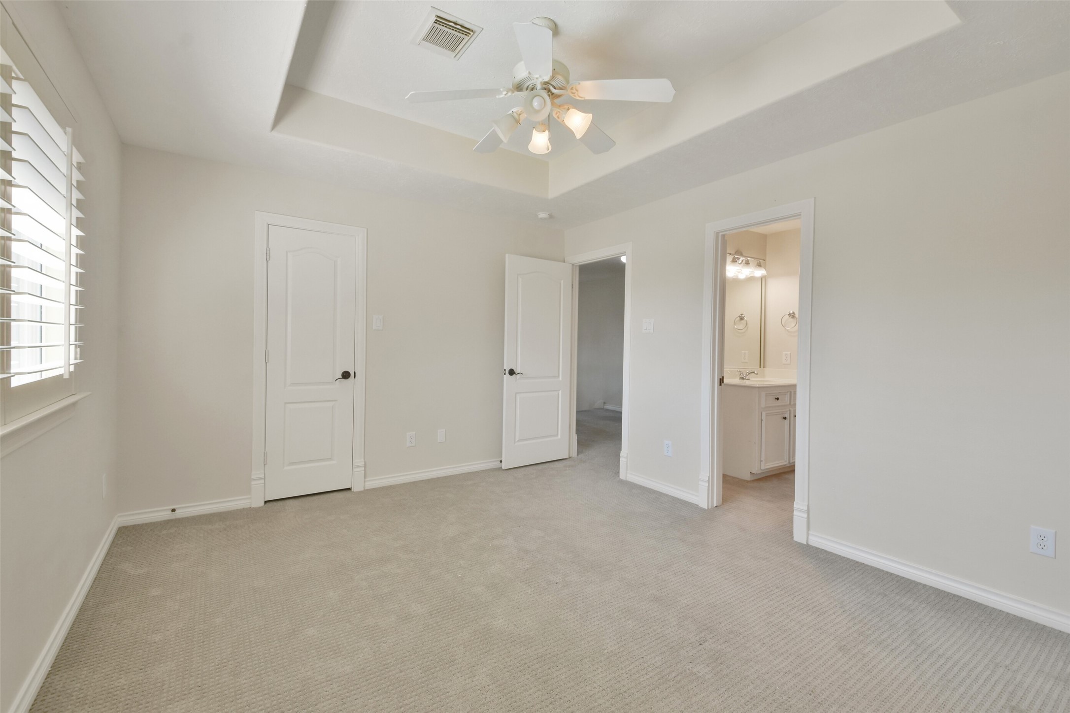 8114 Hideaway Lake Circle Spring, TX 77389 - Photo 31 of 50 an empty room with chandelier fan and windows