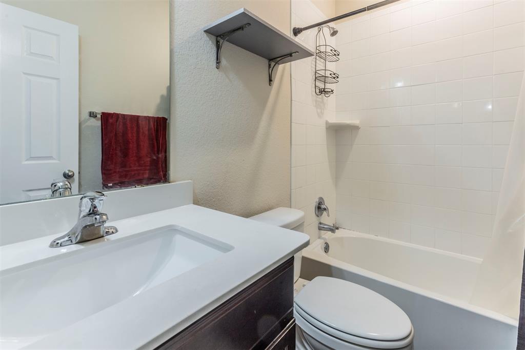 2904 Beutel Road Lorena, TX 76655 - Photo 20 of 40 a bathroom with a sink a toilet and shower