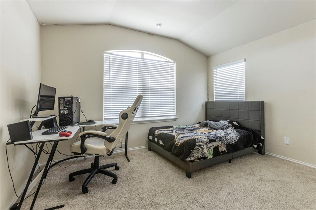 2904 Beutel Road Lorena, TX 76655 - Photo 25 of 40 a bed sitting in a bedroom next to a window