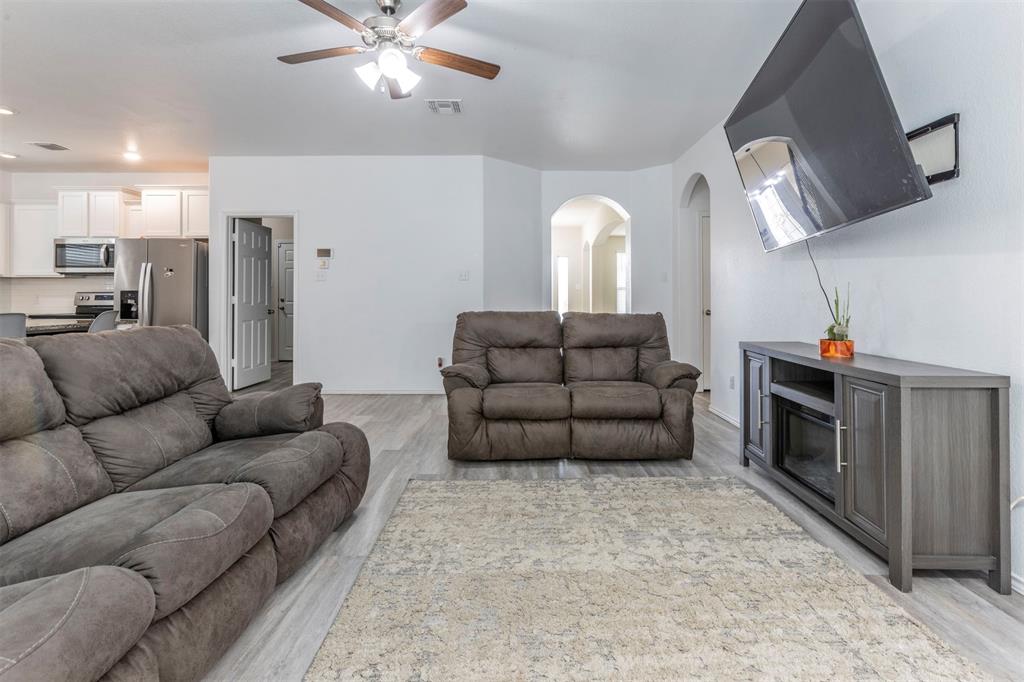 2904 Beutel Road Lorena, TX 76655 - Photo 3 of 40 a living room with furniture and a fireplace