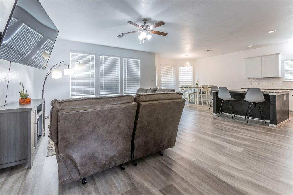 2904 Beutel Road Lorena, TX 76655 - Photo 4 of 40 a living room with furniture and a chandelier