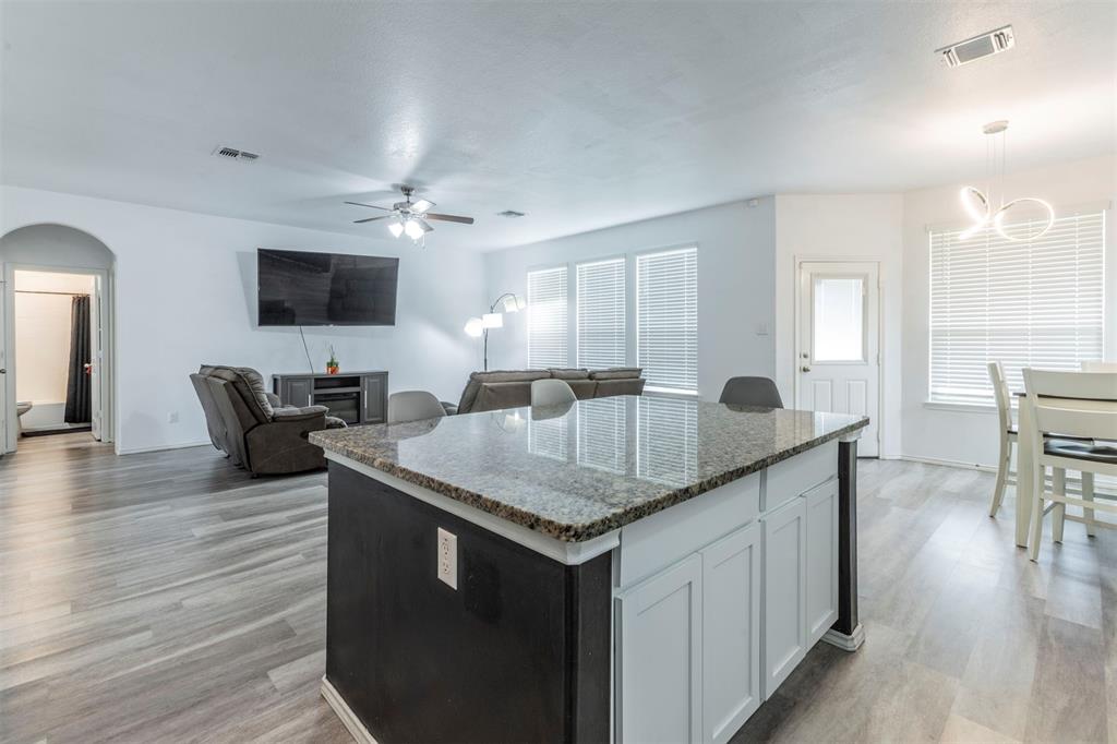 2904 Beutel Road Lorena, TX 76655 - Photo 9 of 40 a kitchen with a stove a sink and a refrigerator