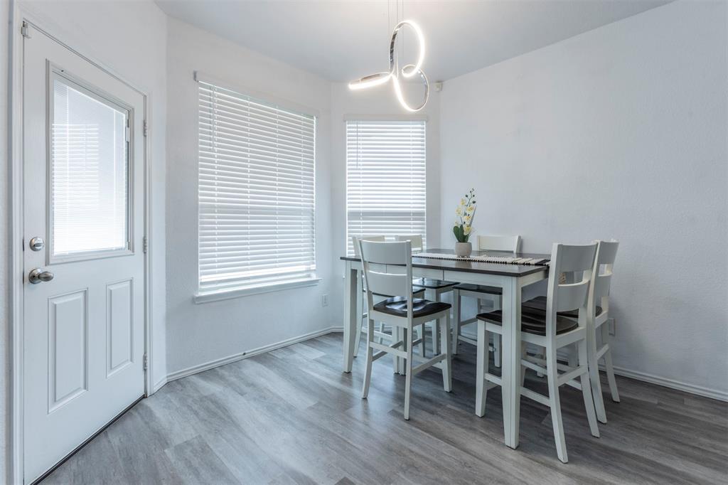 2904 Beutel Road Lorena, TX 76655 - Photo 10 of 40 a view of a dining room with furniture and wooden floor