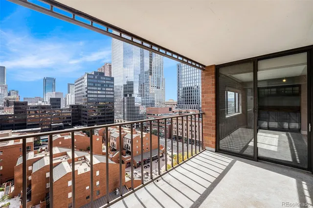 a view of balcony with wooden floor
