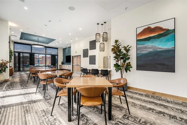 a dinning table and chairs in a room