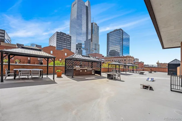 a city view with tall buildings and a bench