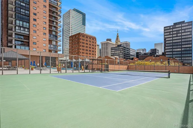 a tennis court with view in the background