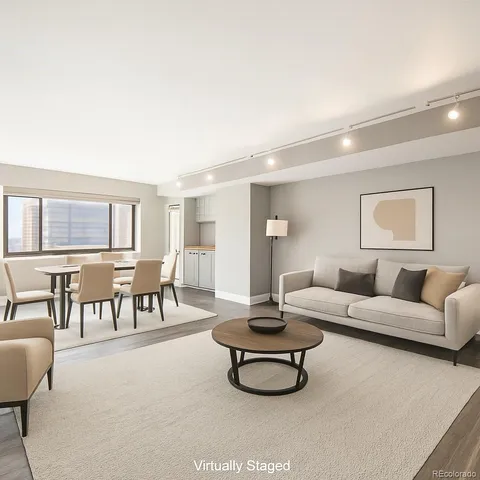 a living room with furniture and a table