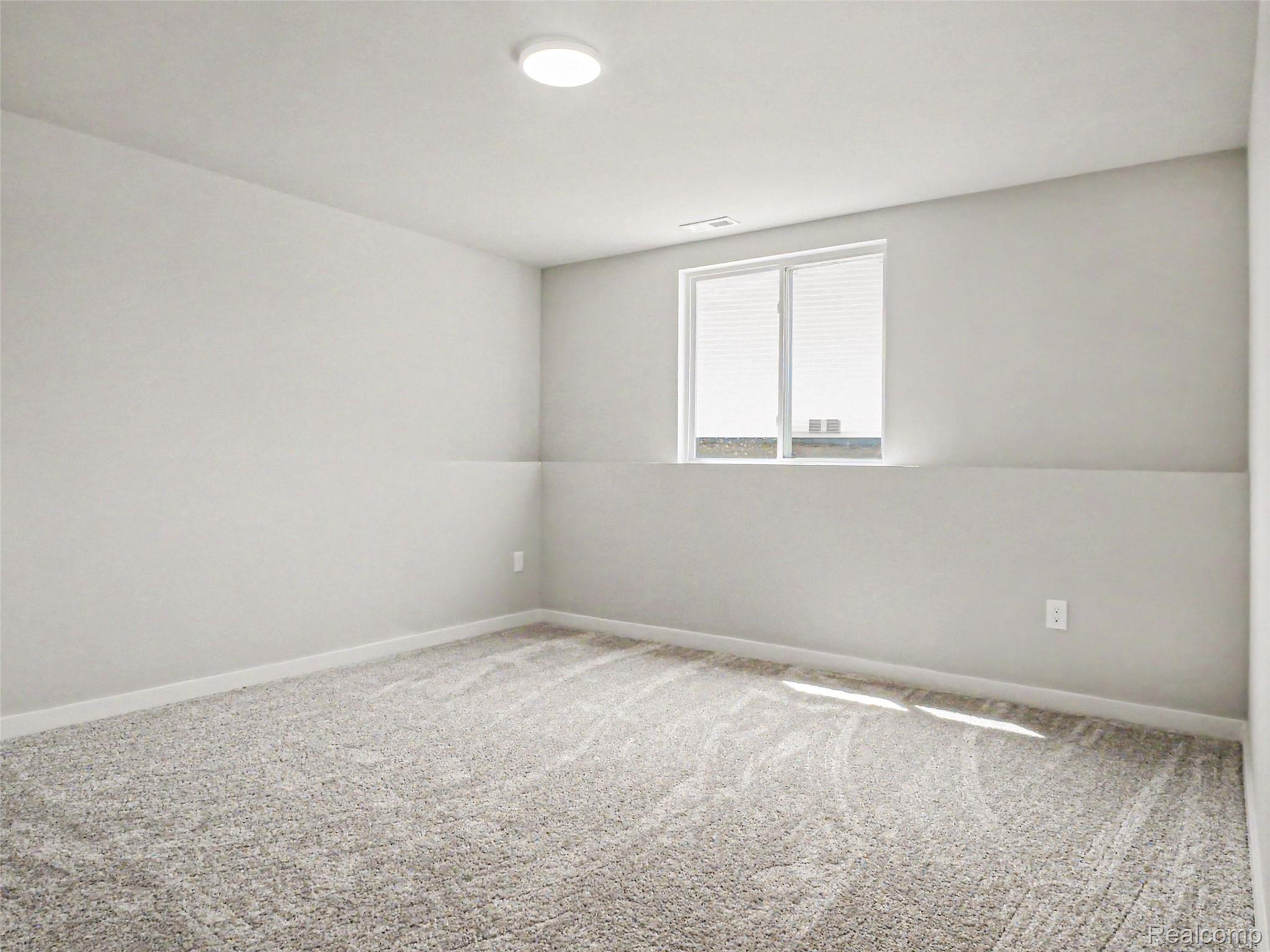 3166 Quail Ridge Court Clio, MI 48420 - Photo 13 of 23 Lower level bedroom 3