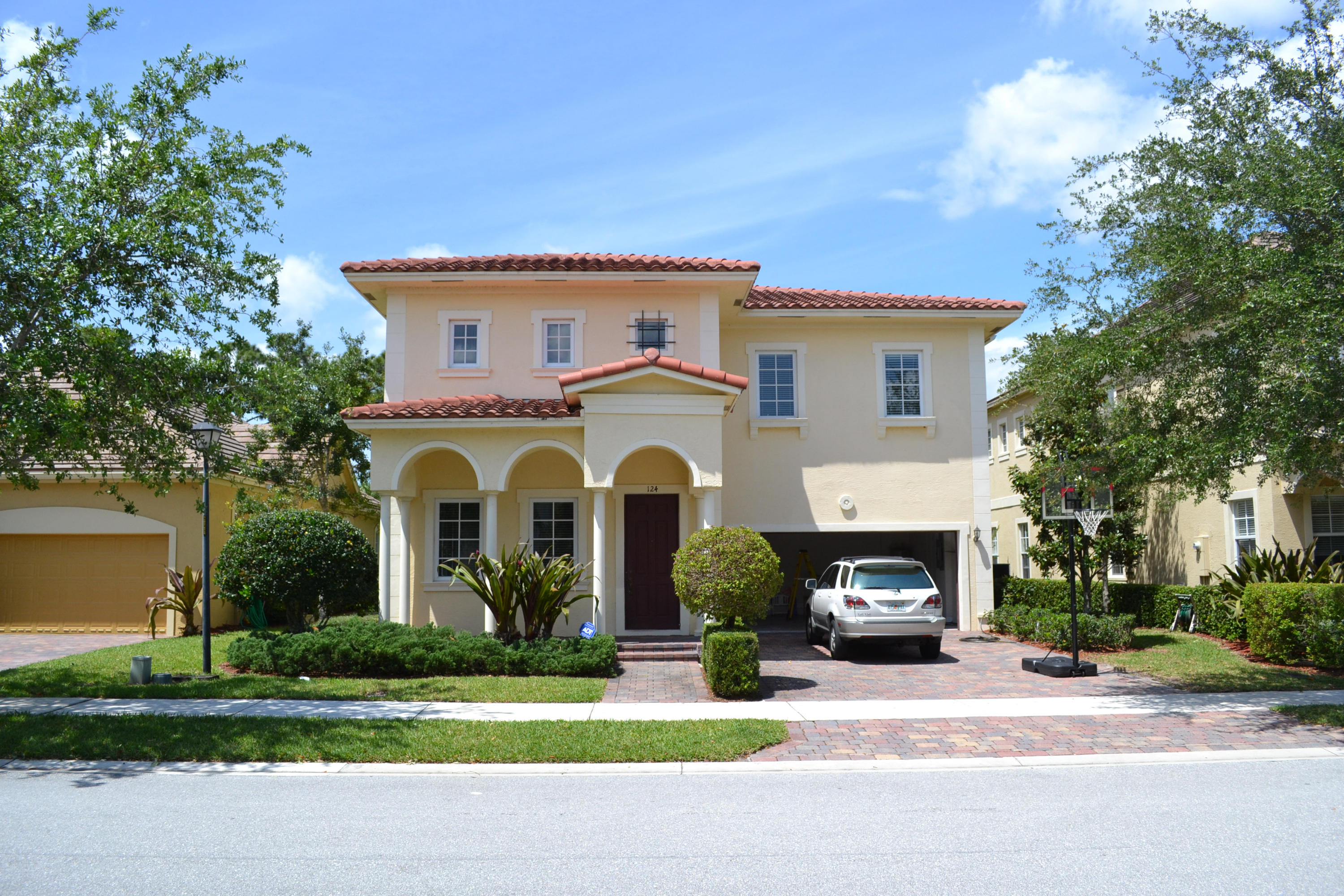 a front view of house with yard and green space