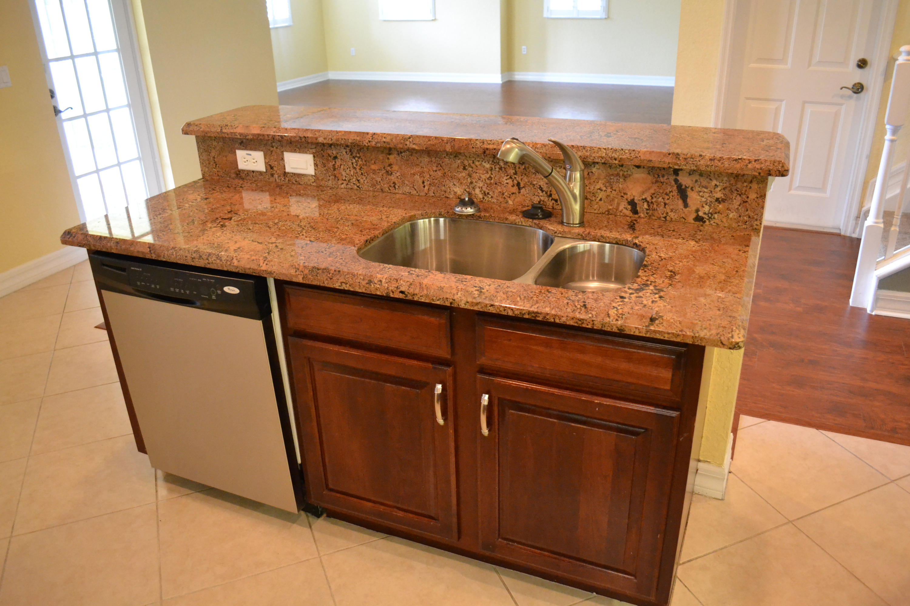 124 Dunmore Drive Jupiter, FL 33458 - Photo 6 of 10 a close view of a sink a mirror and cabinets