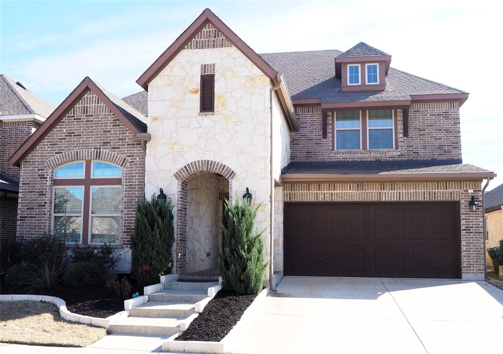 1229 14th Street Argyle, TX 76226 - Photo 1 of 1 a front view of a house with garden