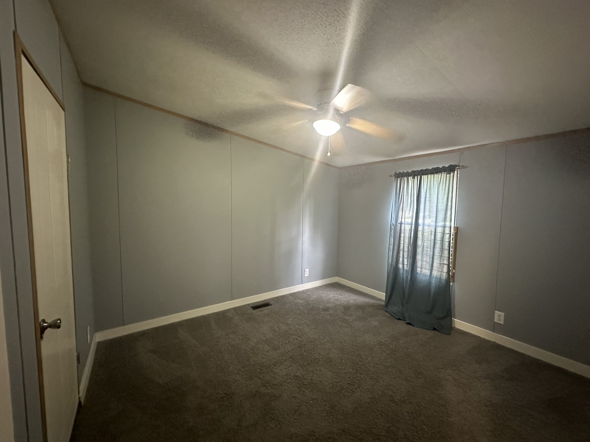 2229 Meekins Road Cleveland, TX 77328 - Photo 23 of 48 an empty room with windows and fan