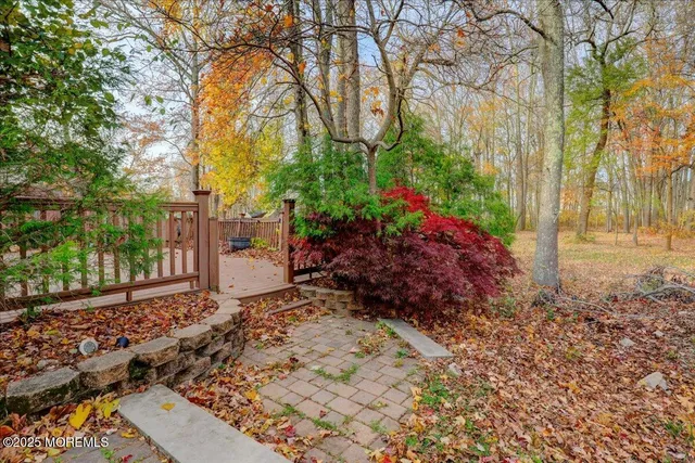 a backyard of apartments with large trees