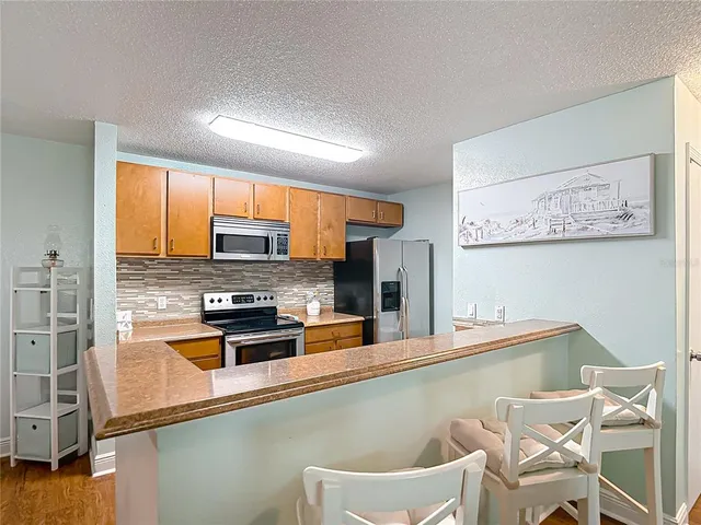 a view of living room with granite countertop furniture and fireplace