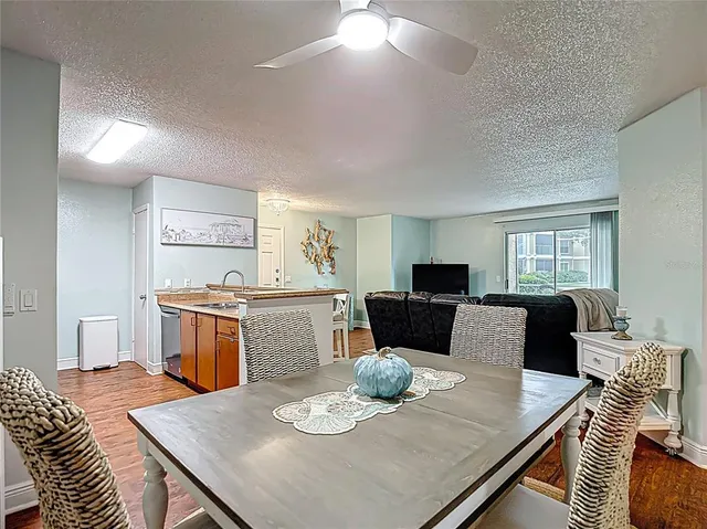 a bedroom with a bed and a lamp on the dresser