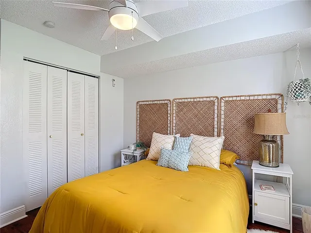 a bedroom with a bed and a dresser in it