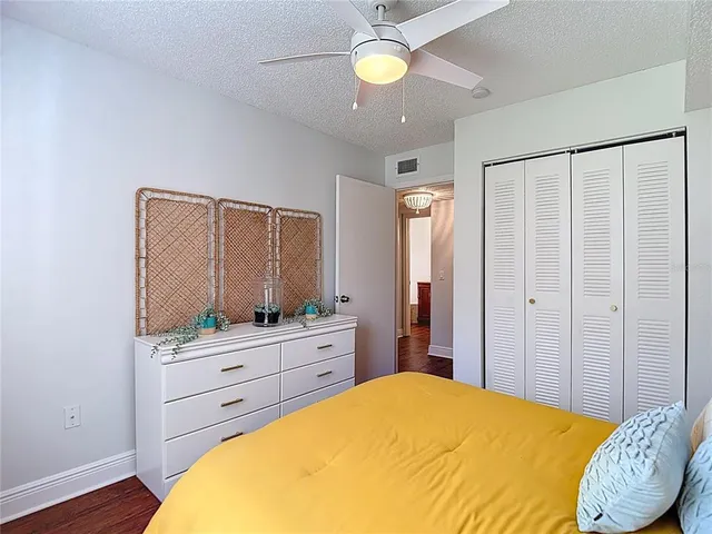 a bedroom with a bed and a couch