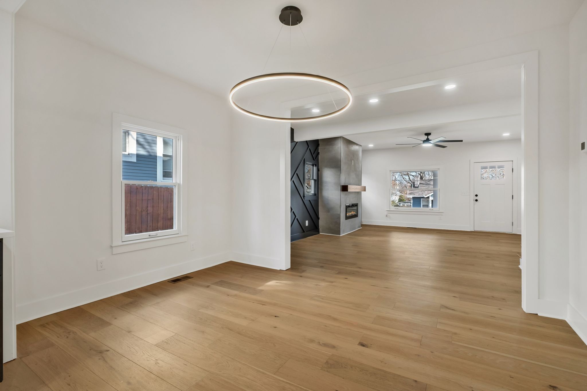 404 Rudolph Avenue Nashville, TN 37206 - Photo 12 of 34 an empty room with wooden floor and windows