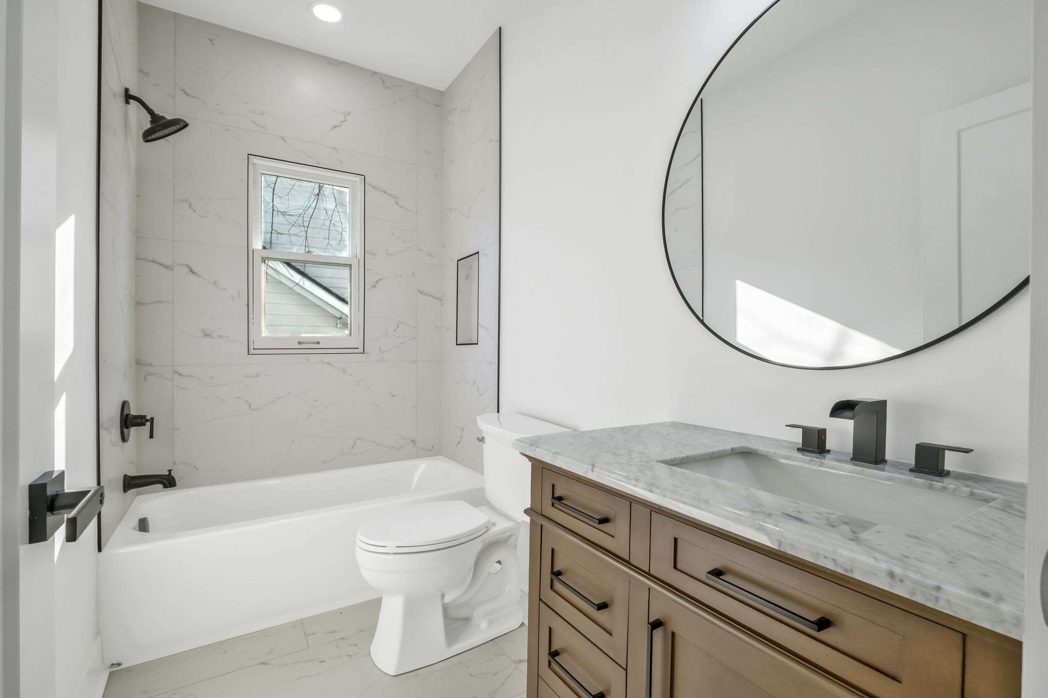 404 Rudolph Avenue Nashville, TN 37206 - Photo 14 of 34 a bathroom with a granite countertop sink a toilet and a mirror