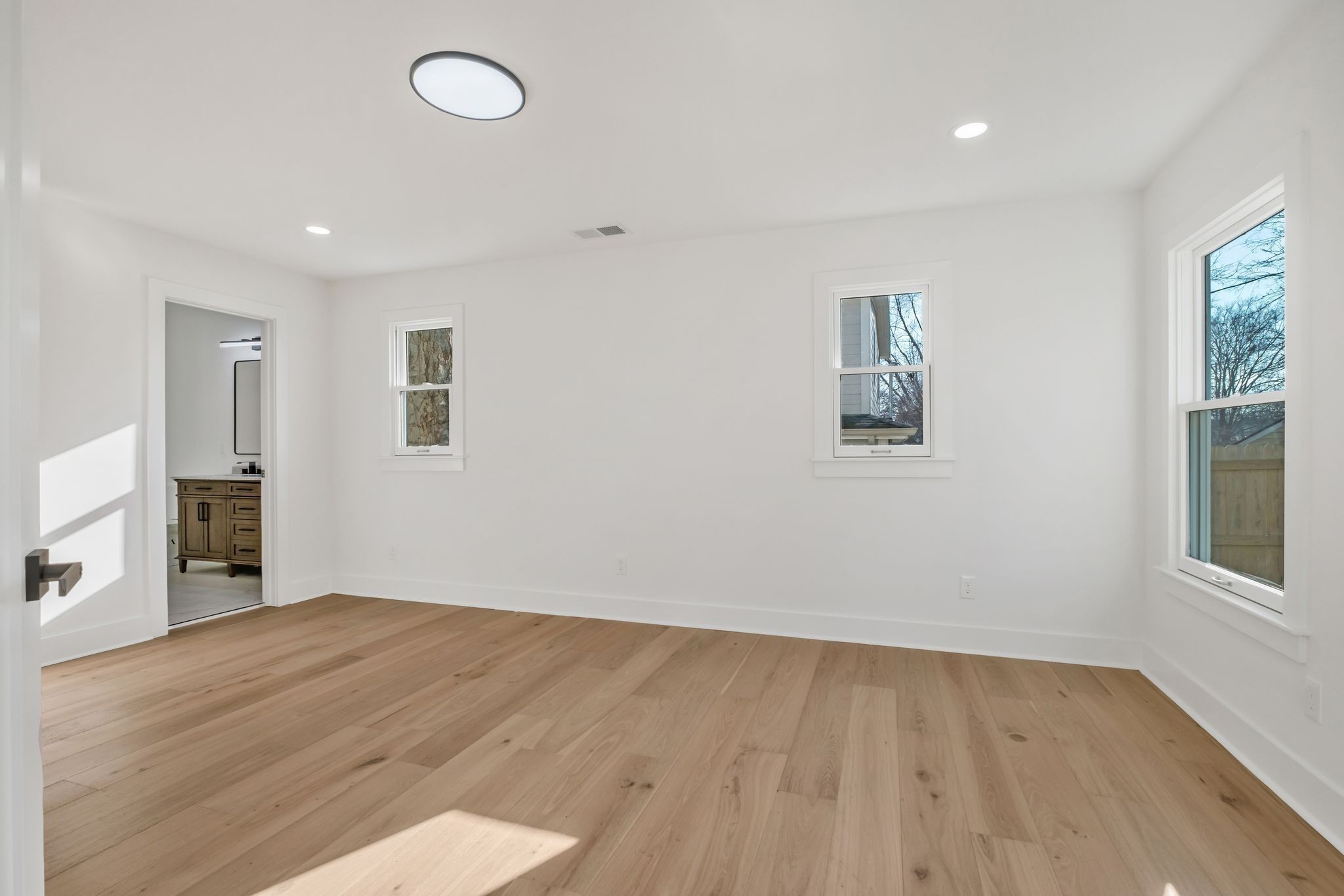 404 Rudolph Avenue Nashville, TN 37206 - Photo 22 of 34 wooden floor in an empty room with a window