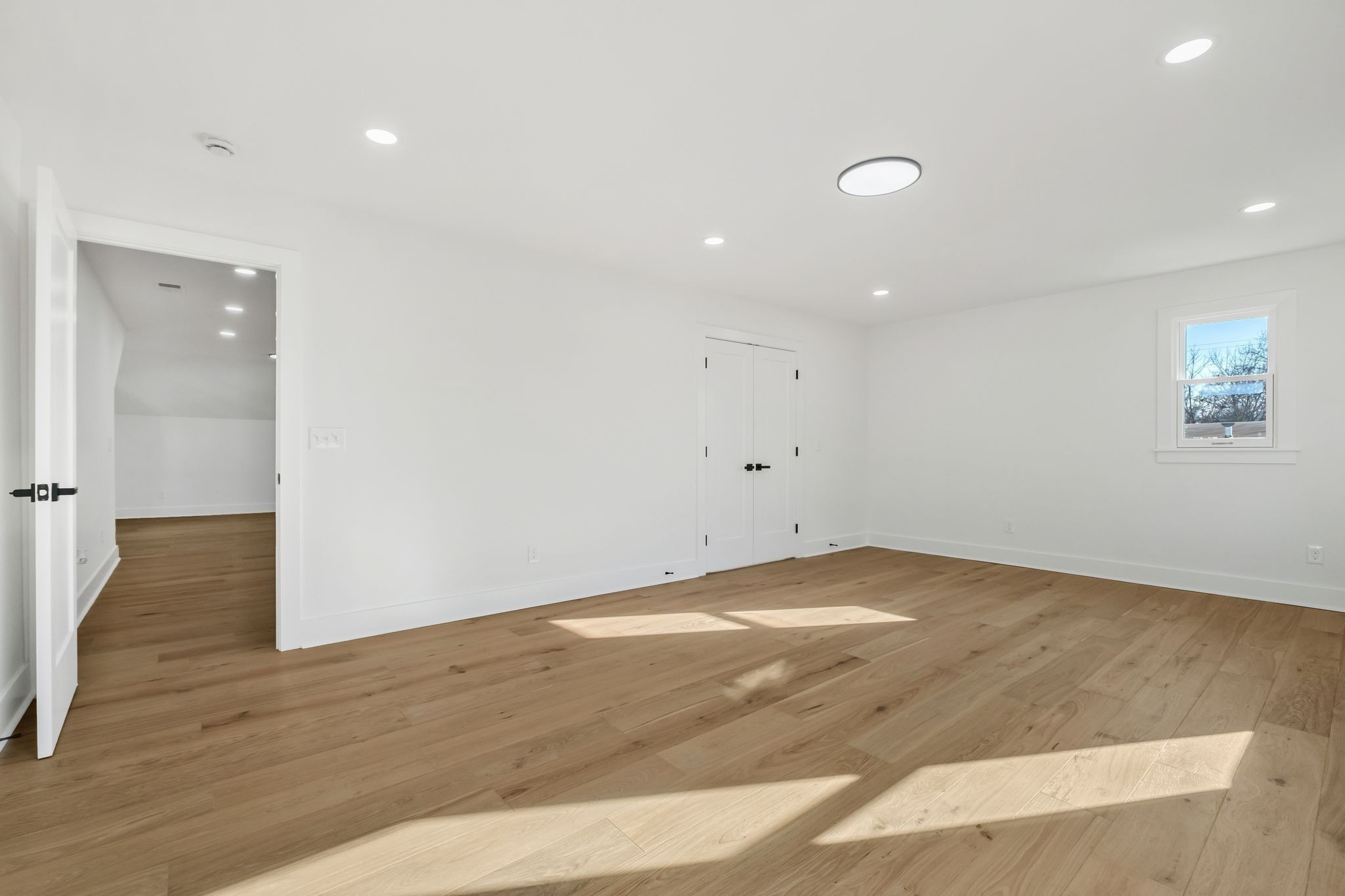 404 Rudolph Avenue Nashville, TN 37206 - Photo 23 of 34 an empty room with wooden floor and windows