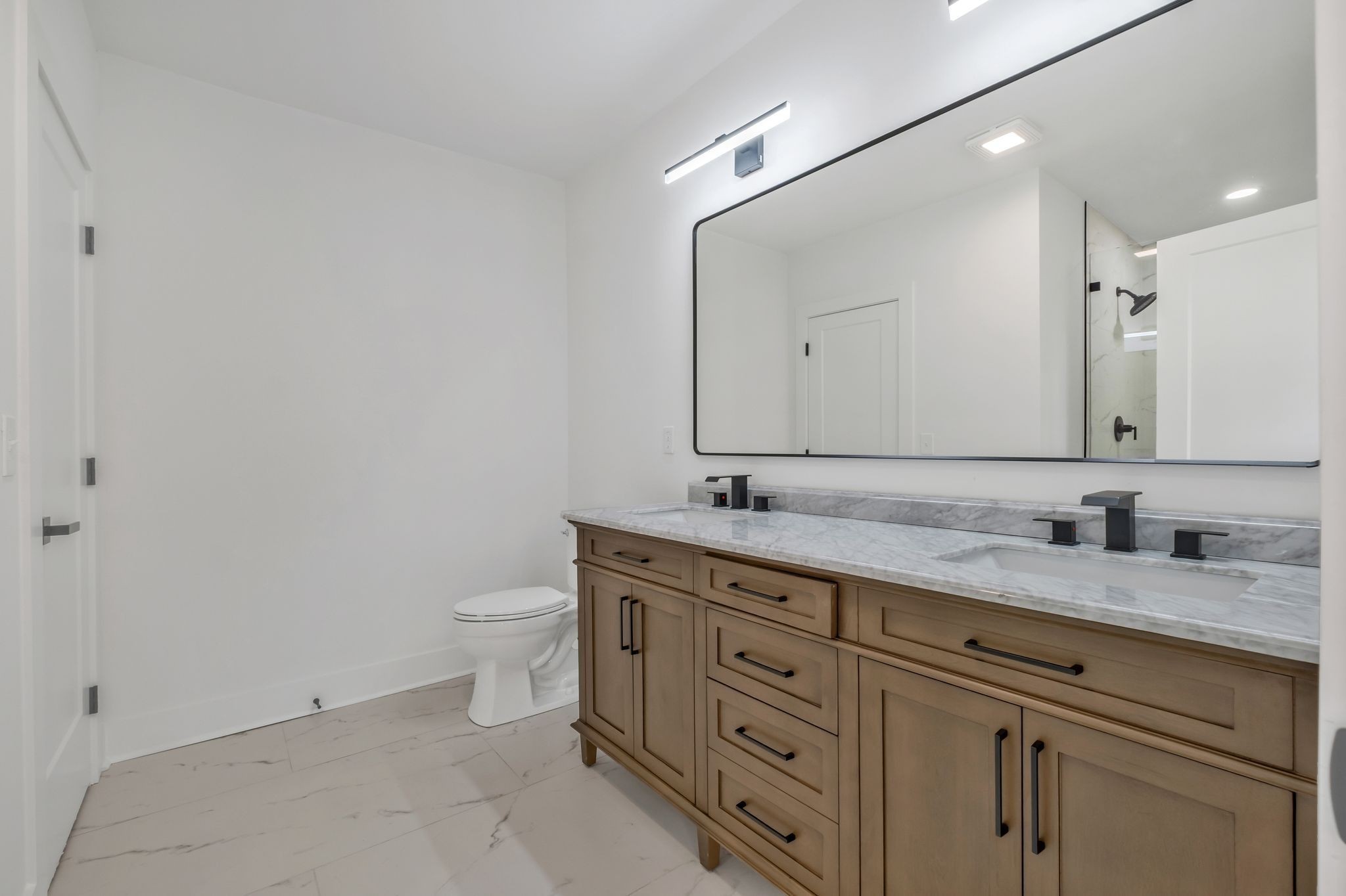 404 Rudolph Avenue Nashville, TN 37206 - Photo 24 of 34 a bathroom with a granite countertop toilet sink and mirror